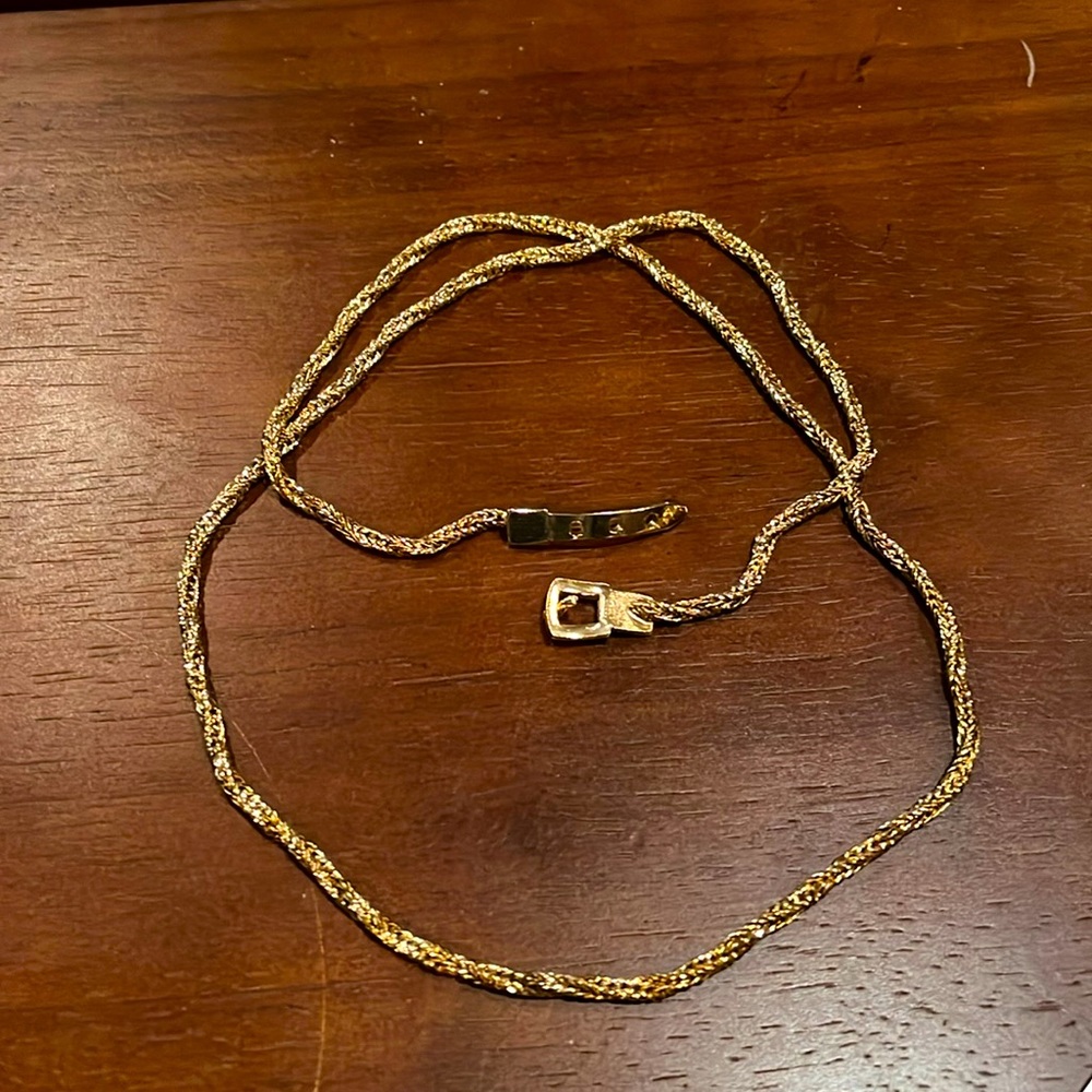 Chain necklace with belt buckle clasp